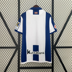 Camisa Real Sociedad Home 24/25 - Macron Torcedor Masculina Lançamento